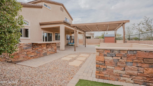 8754 W Denstone Rd, Marana, AZ 85653 - fenced backyard featuring a patio area and a pergola