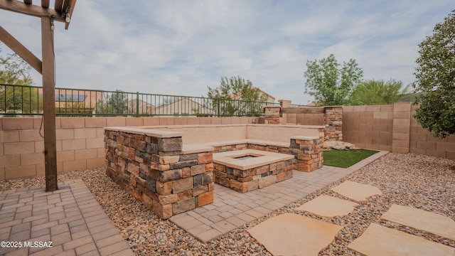 8754 W Denstone Rd, Marana, AZ 85653 - fenced backyard featuring an outdoor fire pit and a patio area