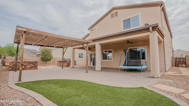 8754 W Denstone Rd, Marana, AZ 85653 - rear view of property with a ceiling fan, a pergola, a patio, and stucco siding