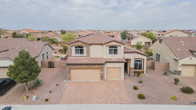8754 W Denstone Rd, Marana, AZ 85653 - view of front of house featuring a residential view, stucco siding, and decorative driveway