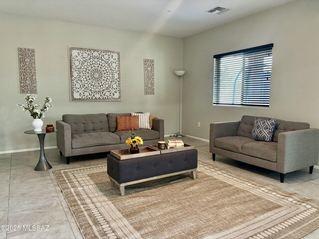 8754 W Denstone Rd, Marana, AZ 85653 - tiled living room with baseboards