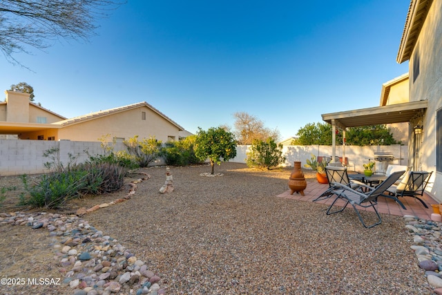 view of yard featuring a patio and a fenced backyard