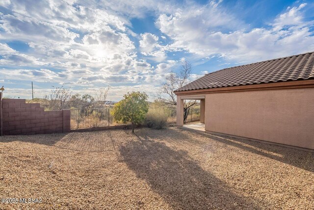 view of yard with a gate and fence