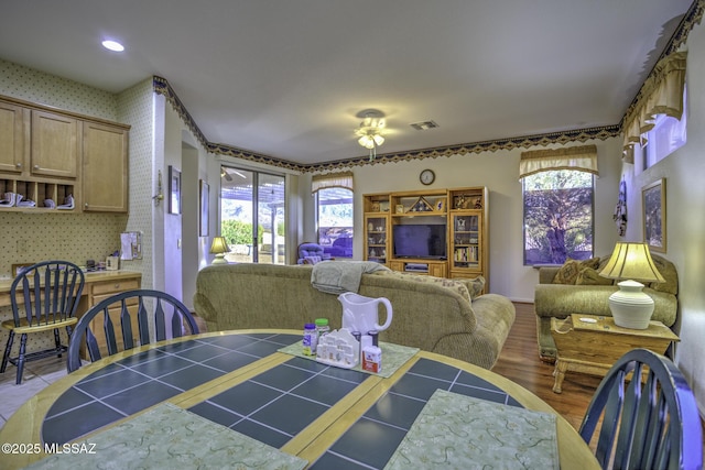 62583 E Amberwood Dr, Saddlebrooke, AZ 85739 - dining room featuring a wealth of natural light, visible vents, wood finished floors, and ceiling fan