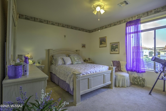 62583 E Amberwood Dr, Saddlebrooke, AZ 85739 - bedroom with multiple windows, visible vents, carpet floors, and a ceiling fan