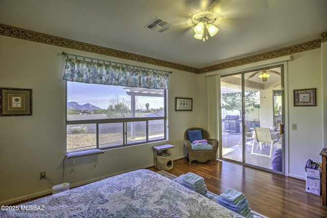 62583 E Amberwood Dr, Saddlebrooke, AZ 85739 - bedroom featuring visible vents, baseboards, wood finished floors, a ceiling fan, and access to exterior