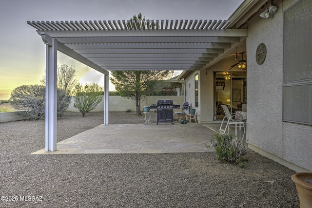 62583 E Amberwood Dr, Saddlebrooke, AZ 85739 - patio terrace at dusk with a pergola and fence
