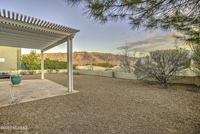 62583 E Amberwood Dr, Saddlebrooke, AZ 85739 - view of yard featuring a pergola, fence, a patio area, and a mountain view