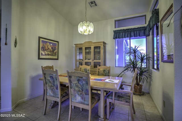 62583 E Amberwood Dr, Saddlebrooke, AZ 85739 - tiled dining space with baseboards, vaulted ceiling, visible vents, and an inviting chandelier