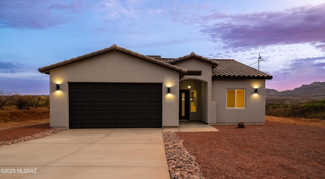 1686 Circulo Bahia, Rio Rico, AZ 85648 - mediterranean / spanish-style house with an attached garage, concrete driveway, stucco siding, and a tiled roof