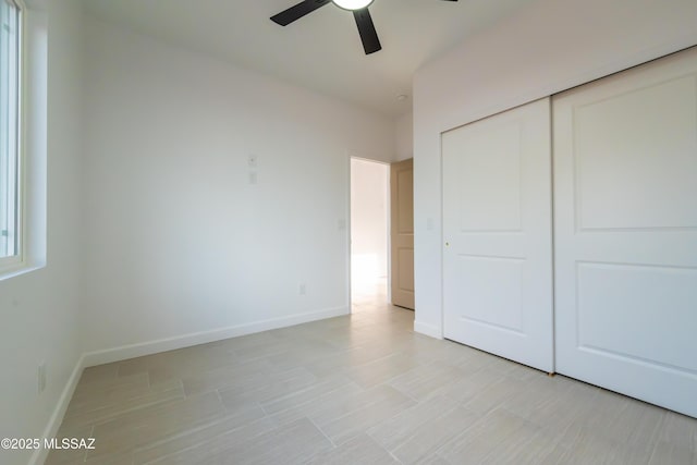 1686 Circulo Bahia, Rio Rico, AZ 85648 - unfurnished bedroom featuring a closet, baseboards, and ceiling fan