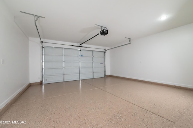 1686 Circulo Bahia, Rio Rico, AZ 85648 - garage featuring a garage door opener and baseboards