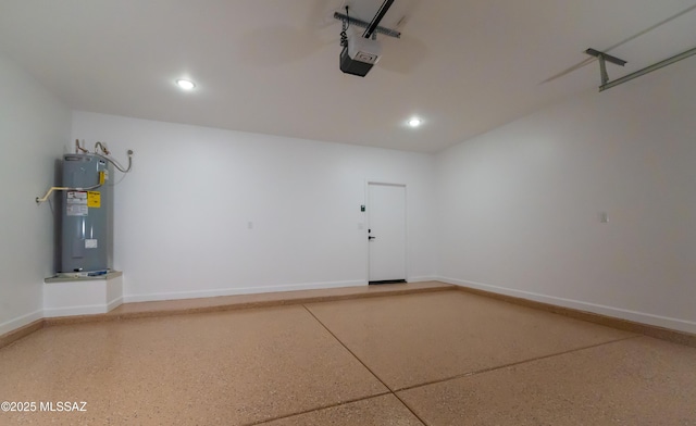 1686 Circulo Bahia, Rio Rico, AZ 85648 - garage with electric water heater, a garage door opener, recessed lighting, and baseboards