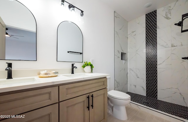1686 Circulo Bahia, Rio Rico, AZ 85648 - bathroom featuring toilet, a marble finish shower, double vanity, and ceiling fan