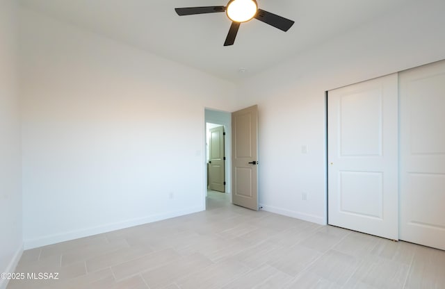 1686 Circulo Bahia, Rio Rico, AZ 85648 - unfurnished bedroom featuring baseboards, a closet, and a ceiling fan