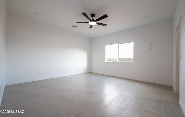 1686 Circulo Bahia, Rio Rico, AZ 85648 - spare room featuring ceiling fan and baseboards
