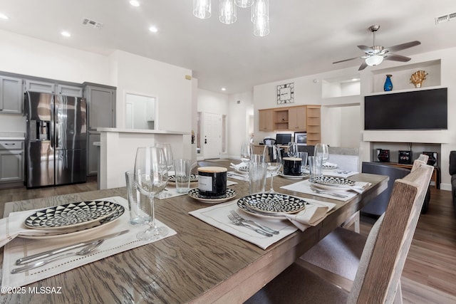 dining area featuring visible vents, wood finished floors, ceiling fan, and recessed lighting