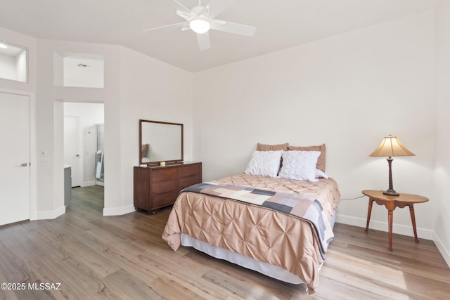bedroom featuring baseboards, light wood-style floors, and ceiling fan