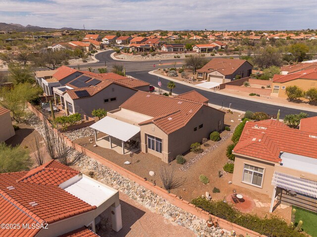 birds eye view of property with a residential view