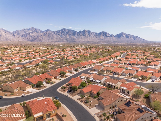 birds eye view of property with a mountain view and a residential view