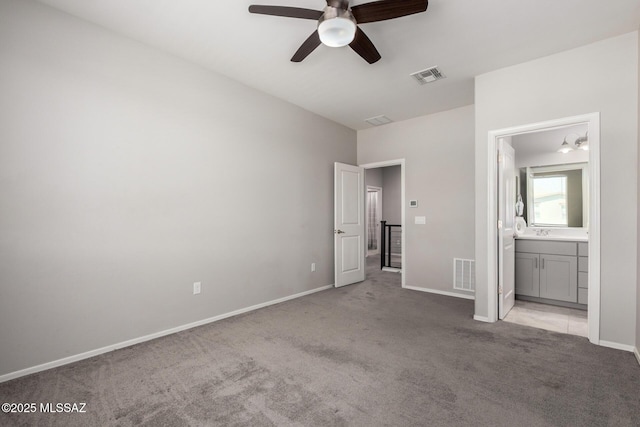 unfurnished bedroom with light colored carpet, baseboards, and visible vents
