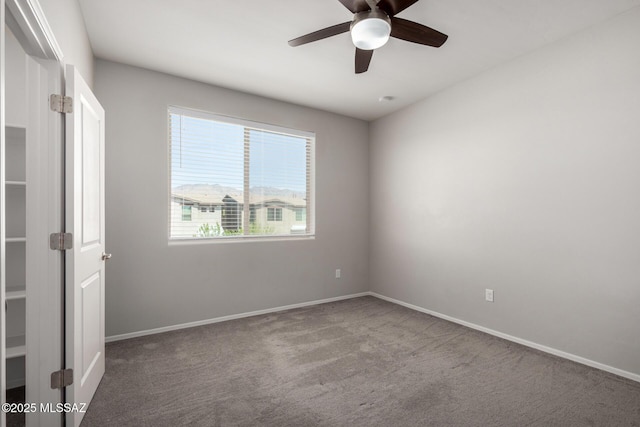 unfurnished room with carpet, baseboards, and ceiling fan