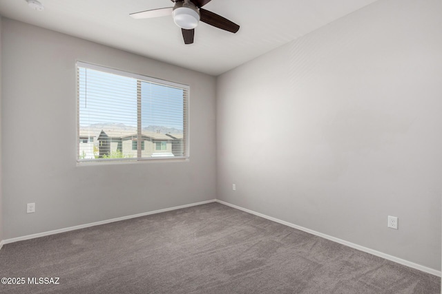 unfurnished room with baseboards, a ceiling fan, and carpet floors