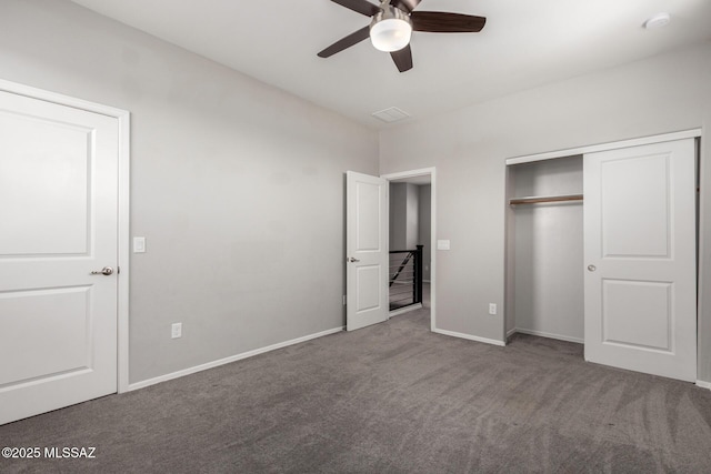 unfurnished bedroom with a closet, baseboards, a ceiling fan, and carpet