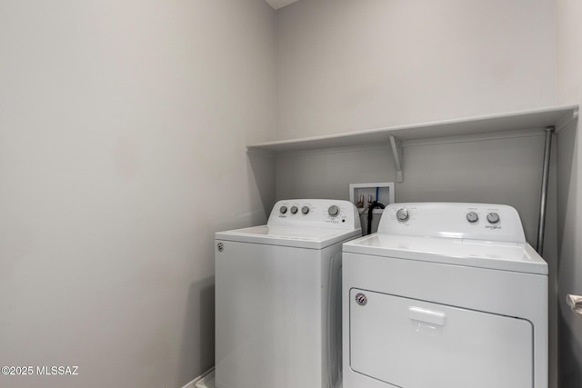 laundry area featuring washing machine and dryer and laundry area