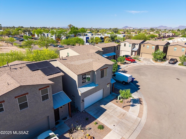 aerial view featuring a mountain view and a residential view