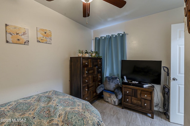 bedroom with vaulted ceiling and a ceiling fan