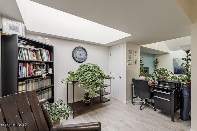 office space with baseboards