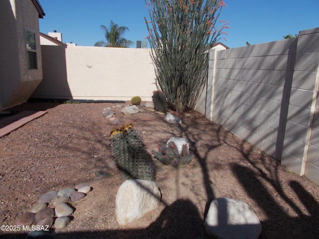 view of yard with a fenced backyard