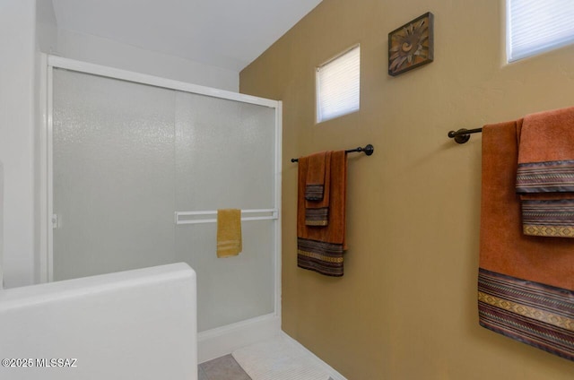full bath featuring an enclosed shower