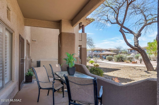 view of patio featuring outdoor dining area