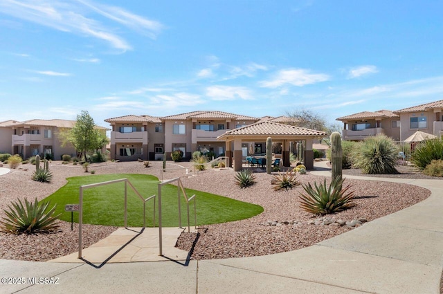 surrounding community featuring a residential view, a gazebo, and a yard