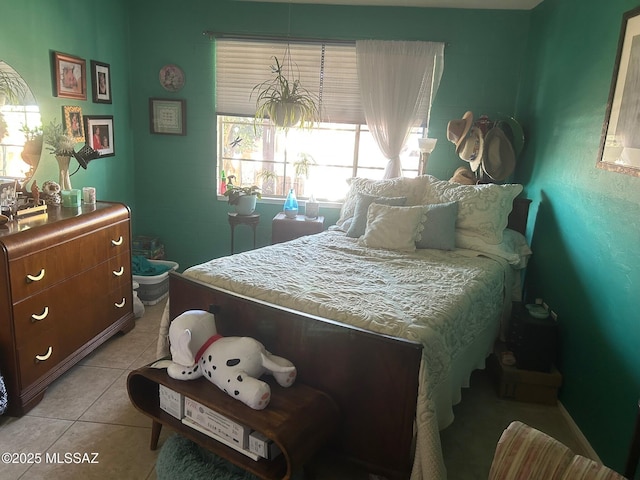 bedroom with light tile patterned floors