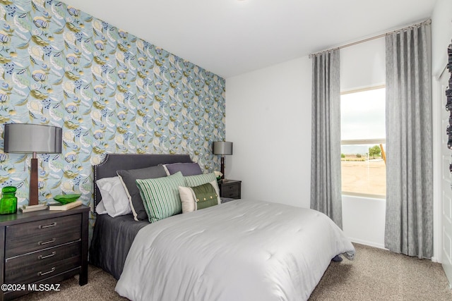 carpeted bedroom with wallpapered walls