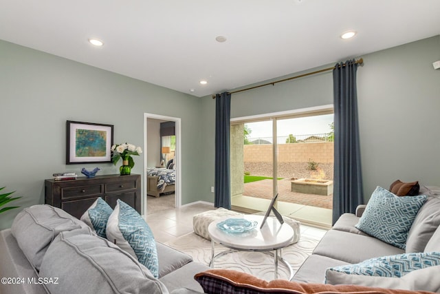 living area with light tile patterned floors, baseboards, and recessed lighting