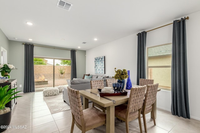 dining area featuring light tile patterned flooring, recessed lighting, and visible vents