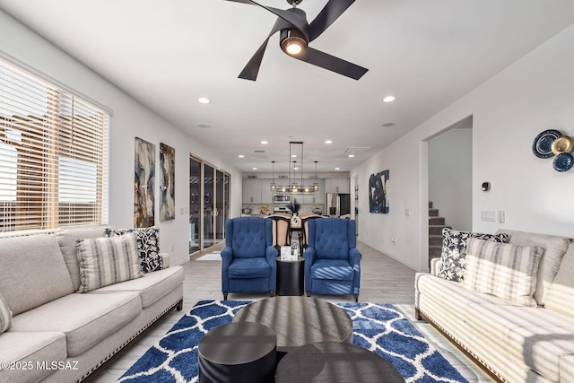 10150 S Rolling Water Dr, Vail, AZ 85641 - living area with light wood-style flooring, a ceiling fan, stairway, visible vents, and recessed lighting