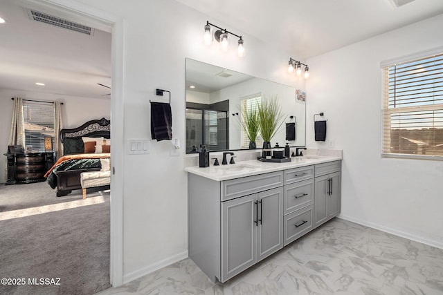 10150 S Rolling Water Dr, Vail, AZ 85641 - bathroom featuring marble finish floor, double vanity, a sink, and visible vents