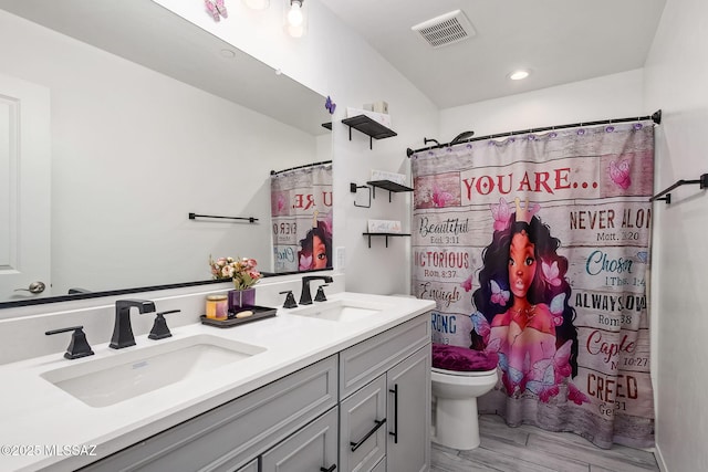 10150 S Rolling Water Dr, Vail, AZ 85641 - full bath with a sink, double vanity, toilet, and visible vents