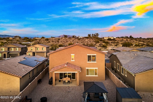 10150 S Rolling Water Dr, Vail, AZ 85641 - rear view of property with a mountain view, stucco siding, a residential view, a gazebo, and a fenced backyard
