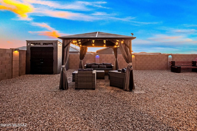 10150 S Rolling Water Dr, Vail, AZ 85641 - view of patio / terrace with a gazebo, an outdoor structure, a storage unit, a fenced backyard, and outdoor lounge area