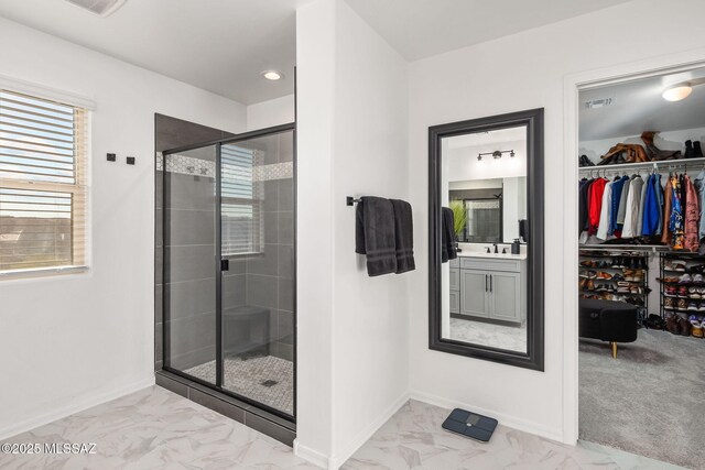 10150 S Rolling Water Dr, Vail, AZ 85641 - bathroom featuring a walk in closet, visible vents, baseboards, a shower stall, and marble finish floor