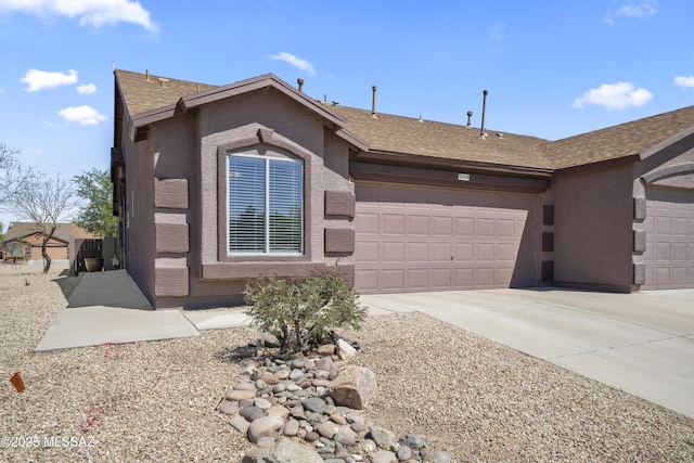ranch-style home featuring stucco siding, a shingled roof, concrete driveway, and an attached garage