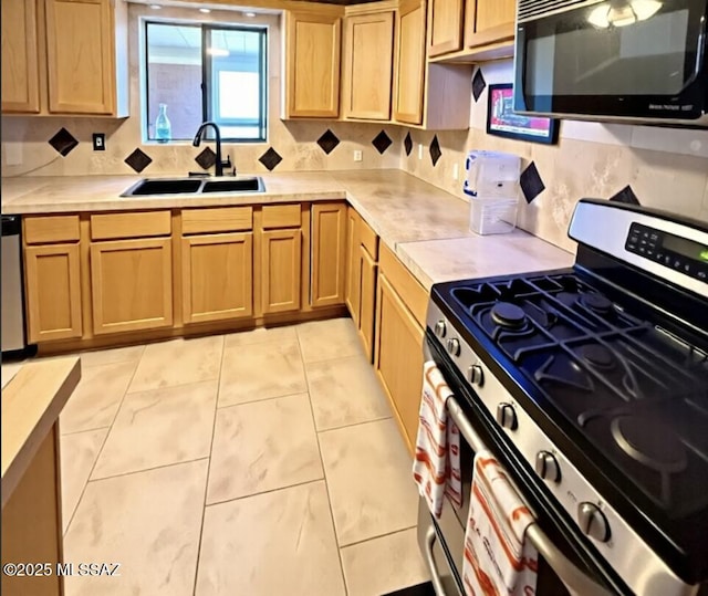 6902 E Calle Neptuno, Tucson, AZ 85710 - kitchen featuring gas range, black microwave, a sink, and light countertops