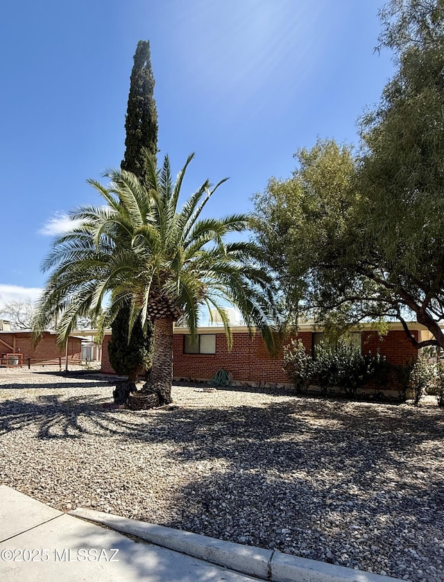 6902 E Calle Neptuno, Tucson, AZ 85710 - view of property exterior with brick siding
