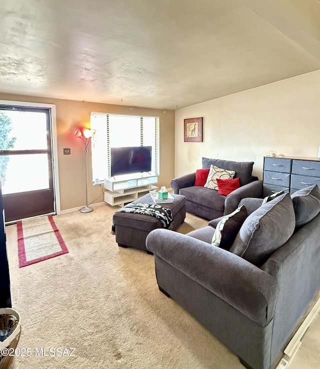 6902 E Calle Neptuno, Tucson, AZ 85710 - carpeted living area featuring plenty of natural light and baseboards